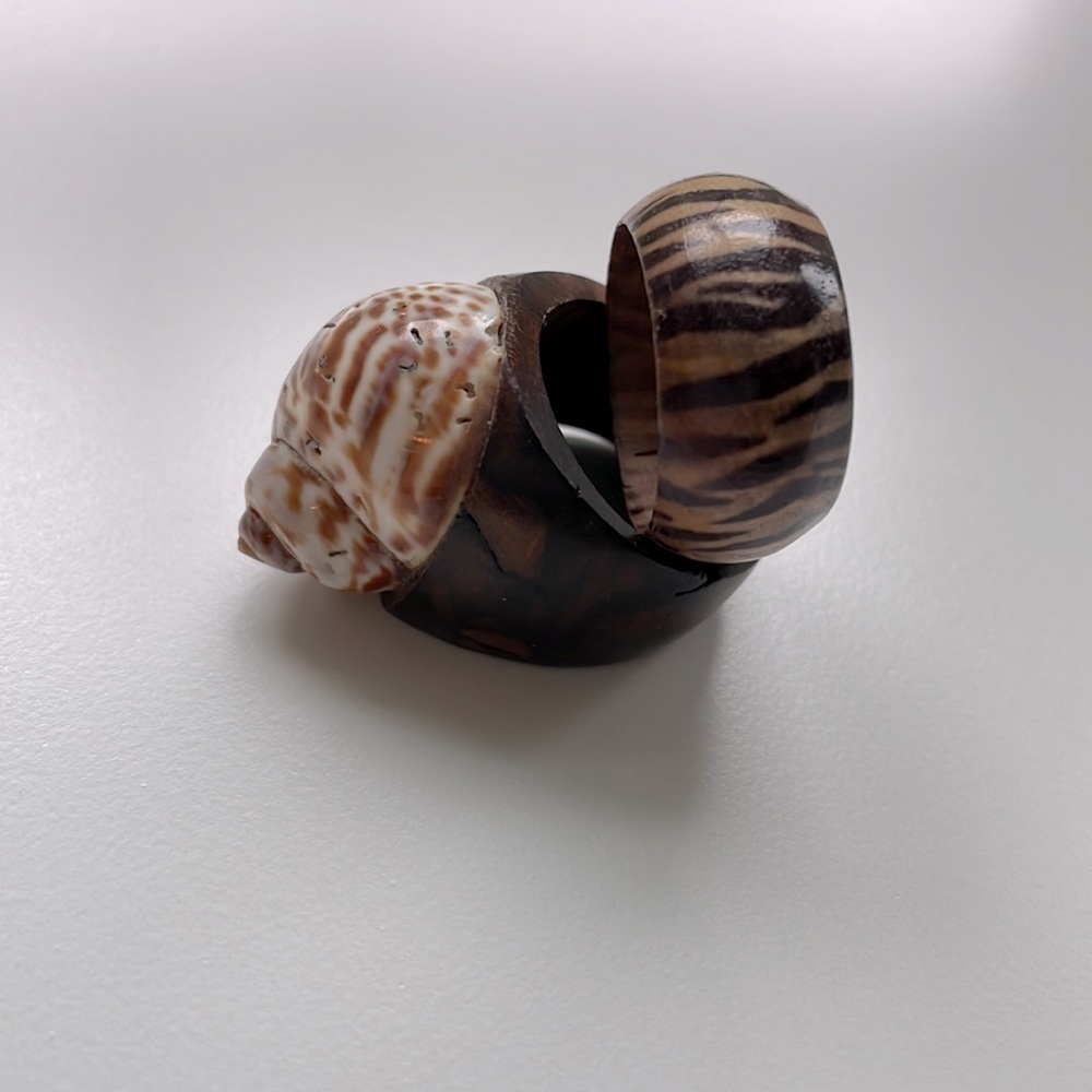 2 wooden rings. Size 7. Very unique, well made. Seashell zebra stripes